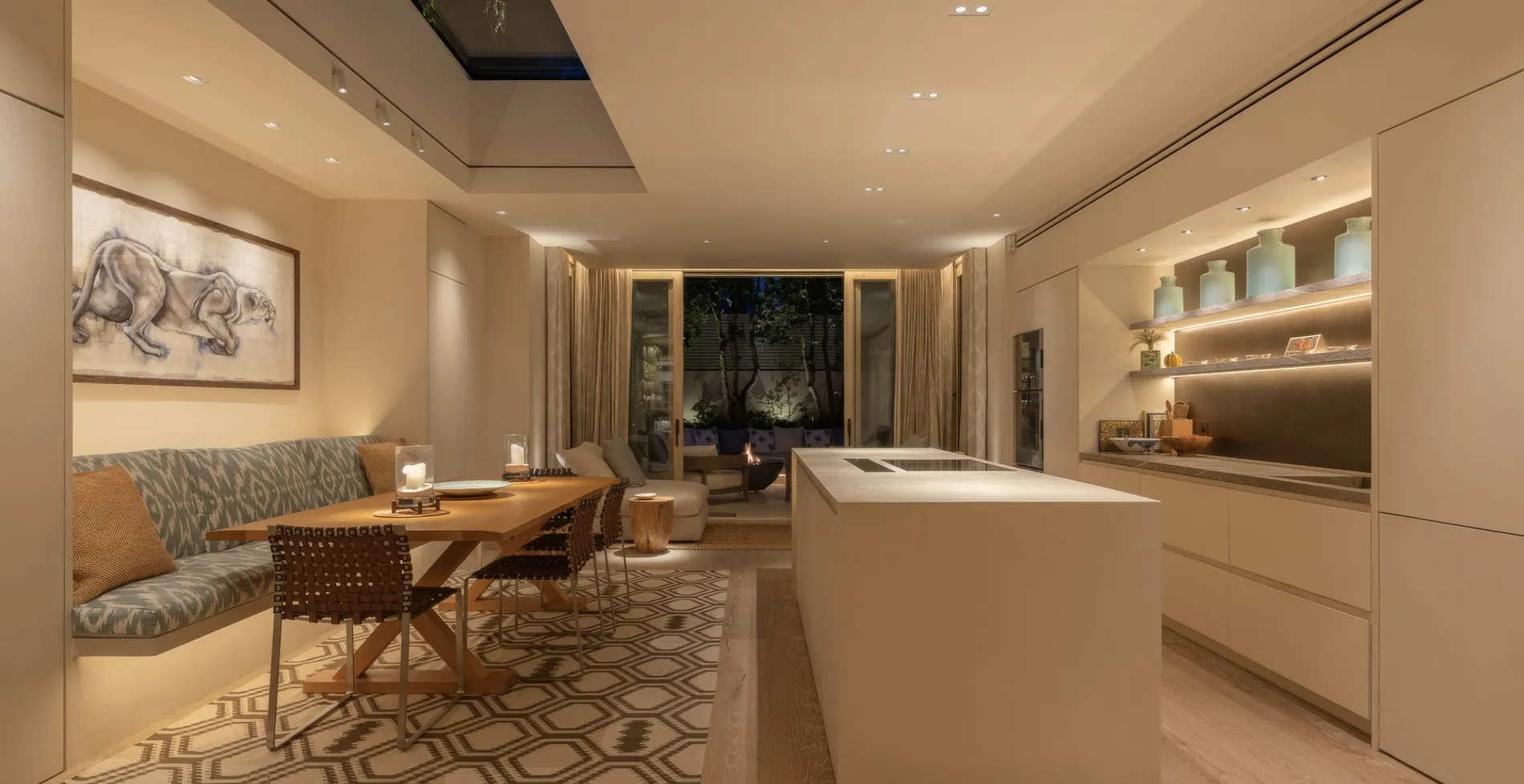 Evening interior with architectural and under-shelf lighting